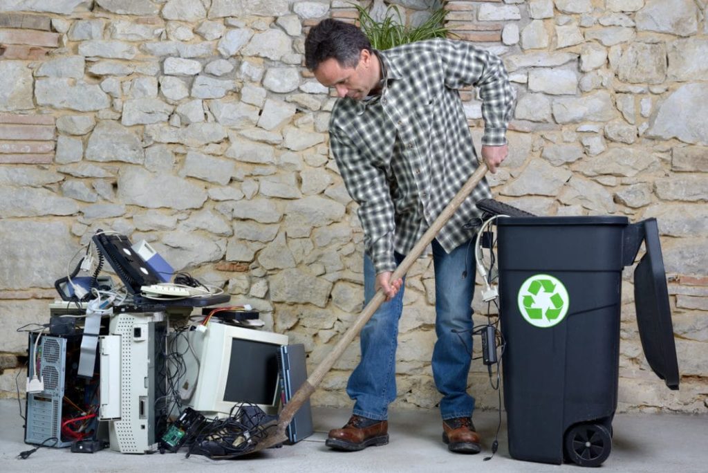 man conducting electronic recycling at his home in washington dc